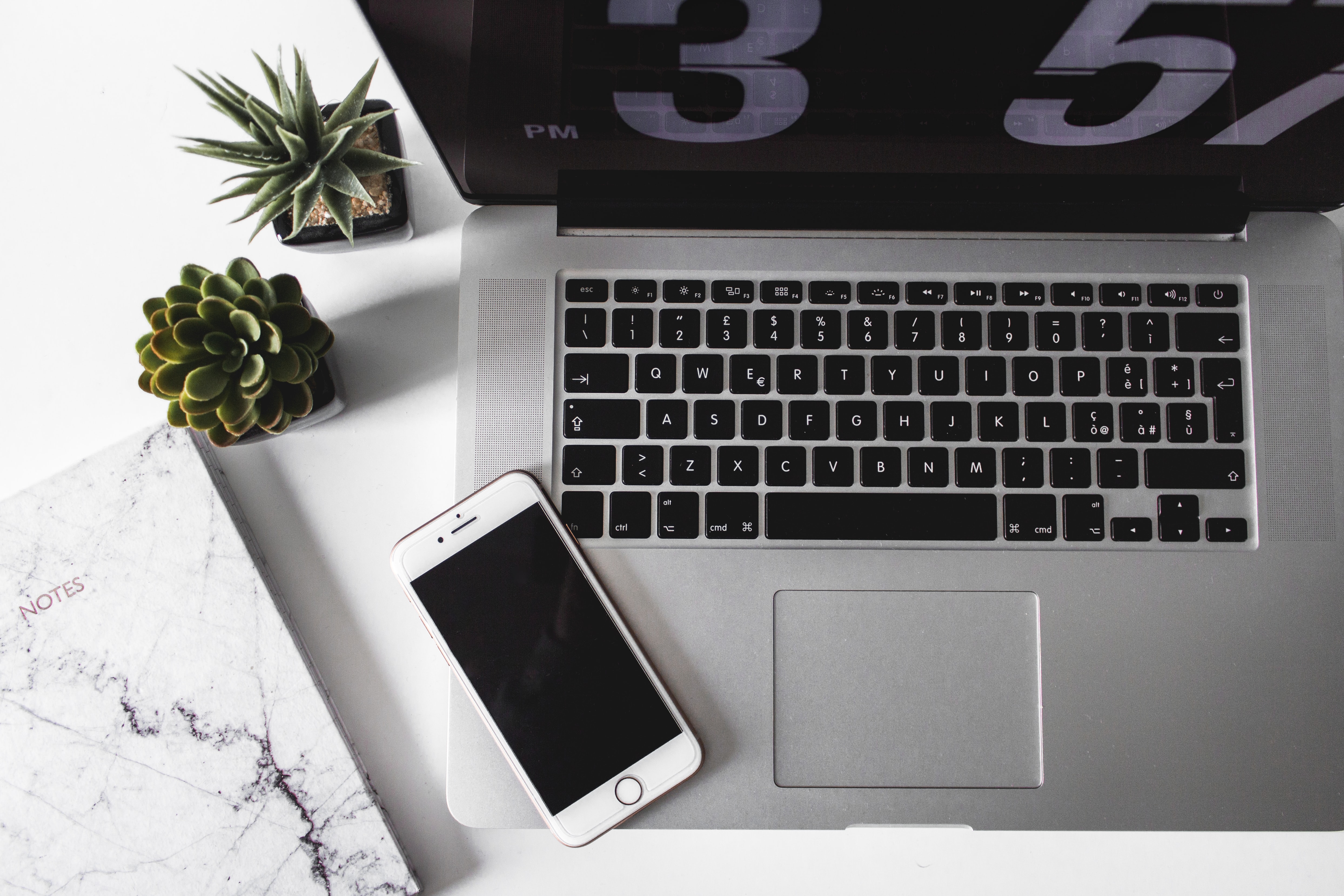 an Iphone on a Macbook