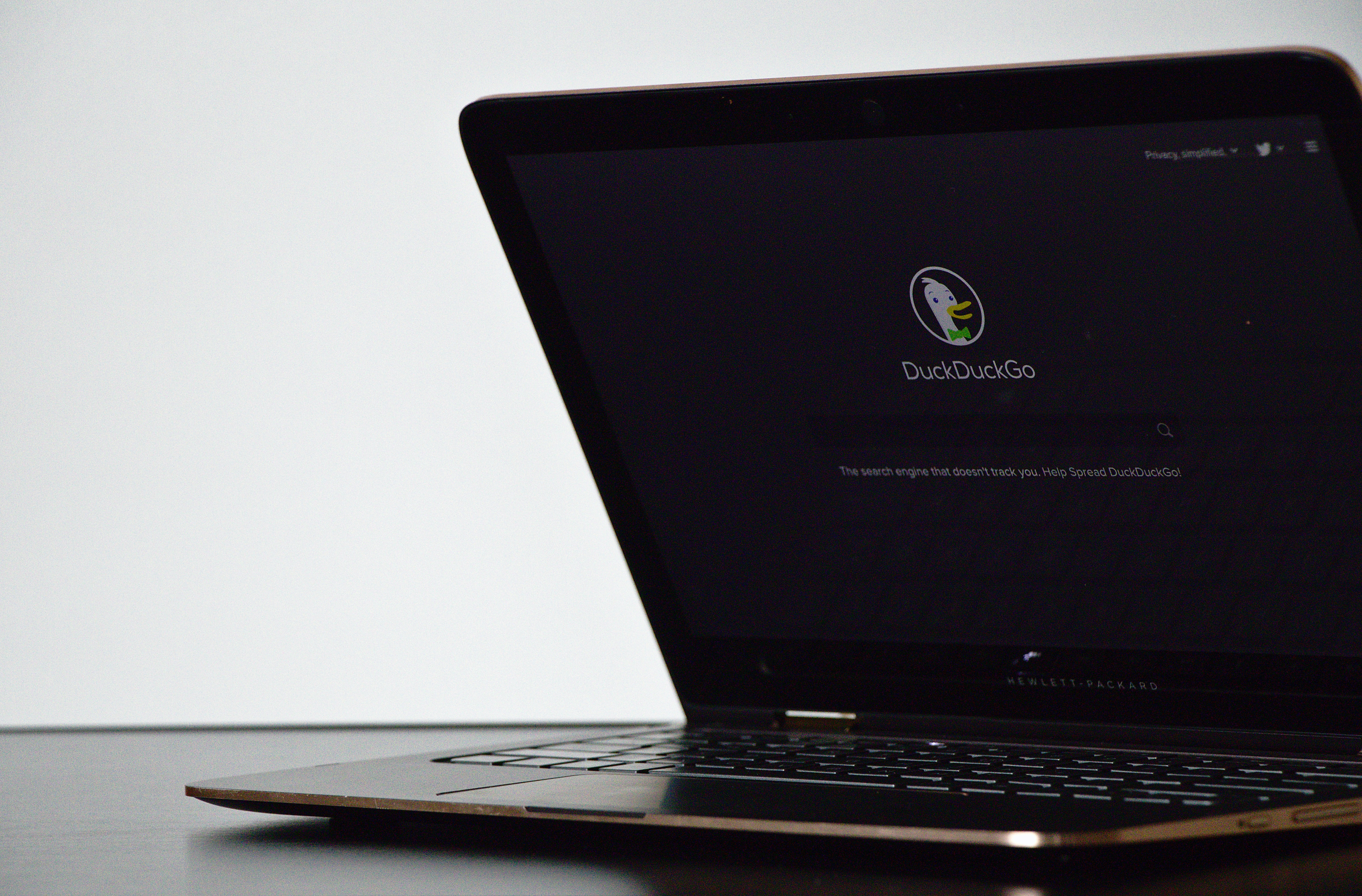 a laptop displaying the duckduckgo search website